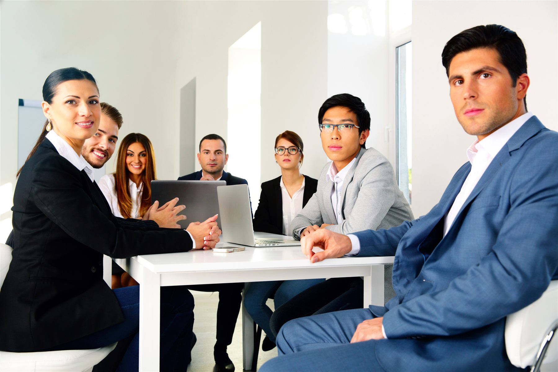 A professional team collaborating around a table